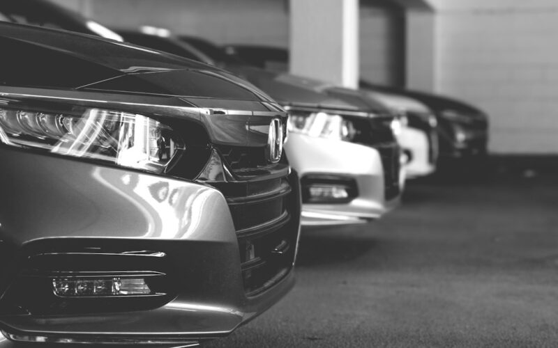 grayscale photo of car on road